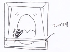 突っ張り棒で支えて絵本を収納